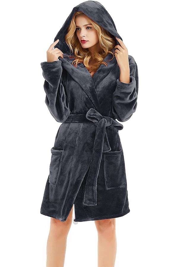 Model wearing plush grey robe with hood and waist tie.