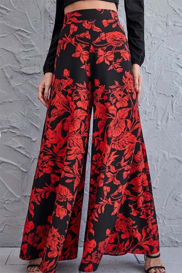 Close-up product shot of red floral wide-legged pant. 