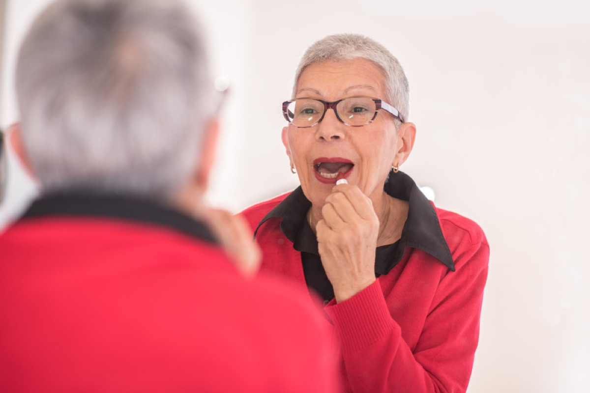 older woman wearing red lipstick, look better after 40