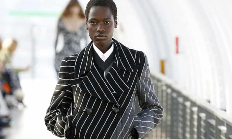 A model wears a monochrome coat by Stella McCartney as part of her fall/winter 2022/2023 women’s ready-to-wear collection show at Paris fashion week.