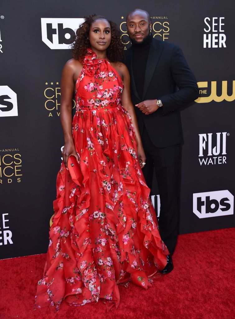 Issa Rae (left) her husband Louis Diame (right) attend the 27th annual Critics' Choice Awards held at the Fairmont Century Plaza Hotel in Los Angeles, CA on March 13, 2022.