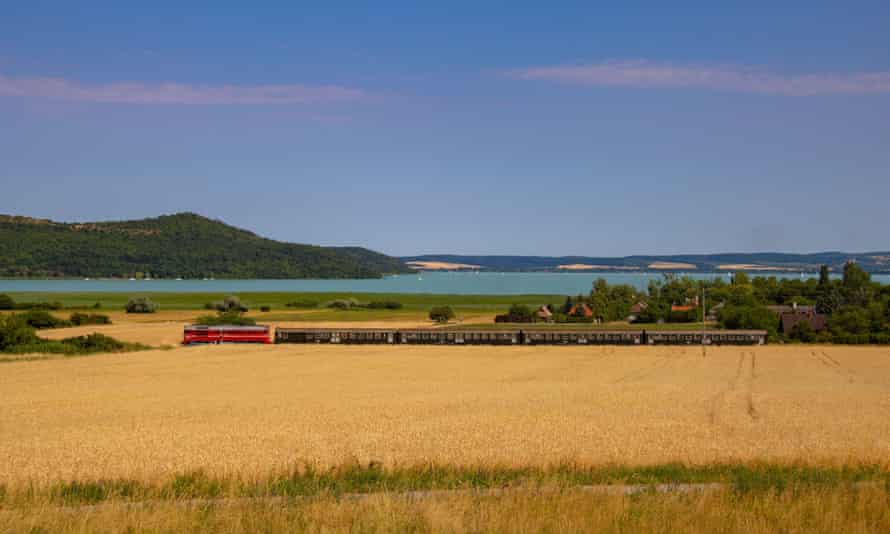 Old Hungarian train at Lake Balaton, in a beautiful landscape, with Tihany in the background.