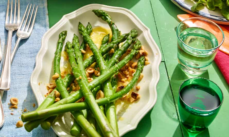 Rachel Roddy’s asparagus with melted butter and toasted hazelnuts.