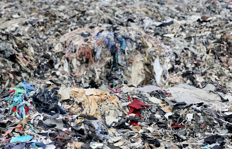 Pile of clothes in landfill