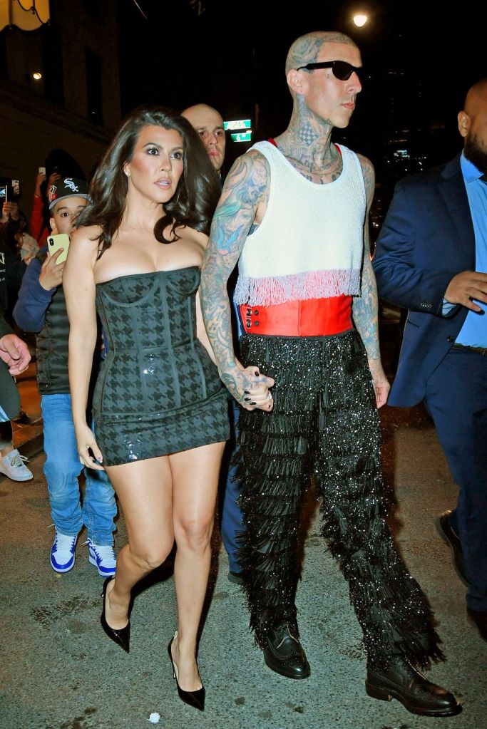 Kourtney Kardashian and Travis Barker head to the Met Gala after party.