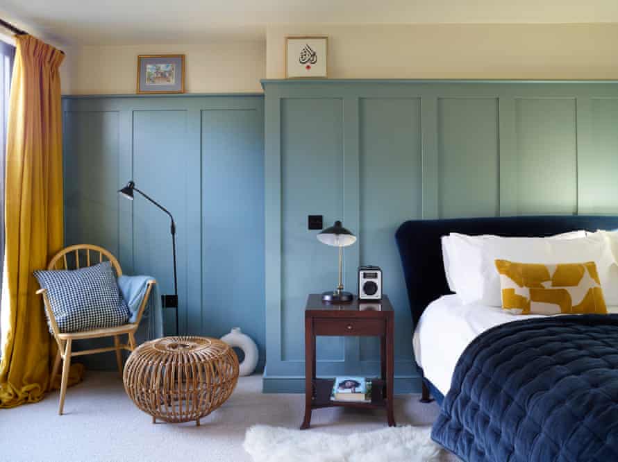 Playing with pattern and scale: blue panelling and complementary accessories in the bedroom.
