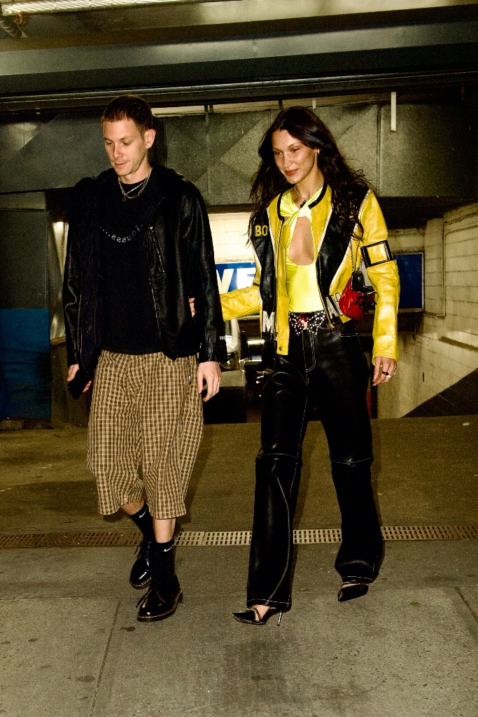 bella hadid, nyc, yellow long sleeve top, black leather pants, pointed toe pumps, yellow jacket, marc kalman