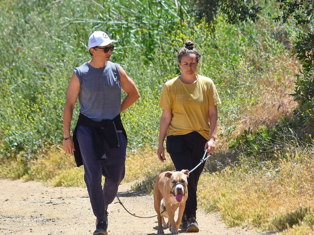 Alicia Silverstone walking her dog.