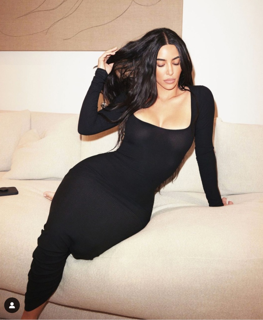 Kim Kardashian lounges in Skim's black Soft Lounge Long Sleeve Dress.