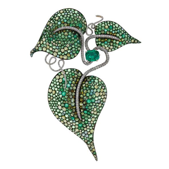 The leaf brooch is decorated with 11.96 carats of emeralds, beryls, peridots, garnets, tourmalines and diamonds, and could go for as much as $700,000.