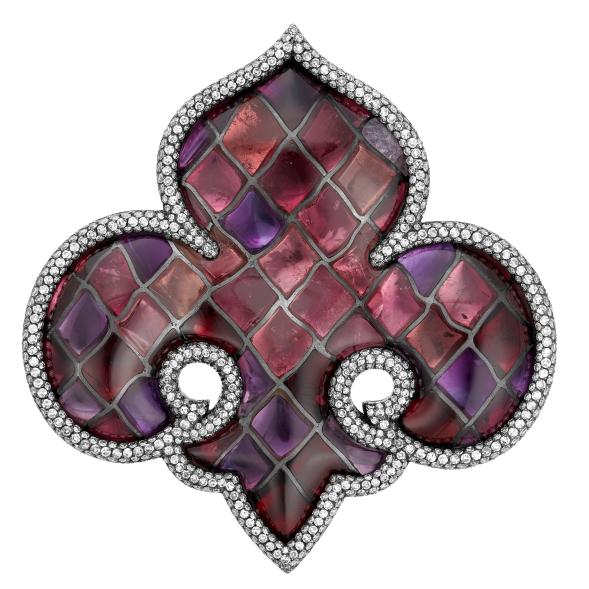 The Vitrail Fleur-de-Lys brooch is made with polished amethysts, pink tourmalines, garnets and round diamonds, and is expected to sell for anywhere between $80,000-$120,000.