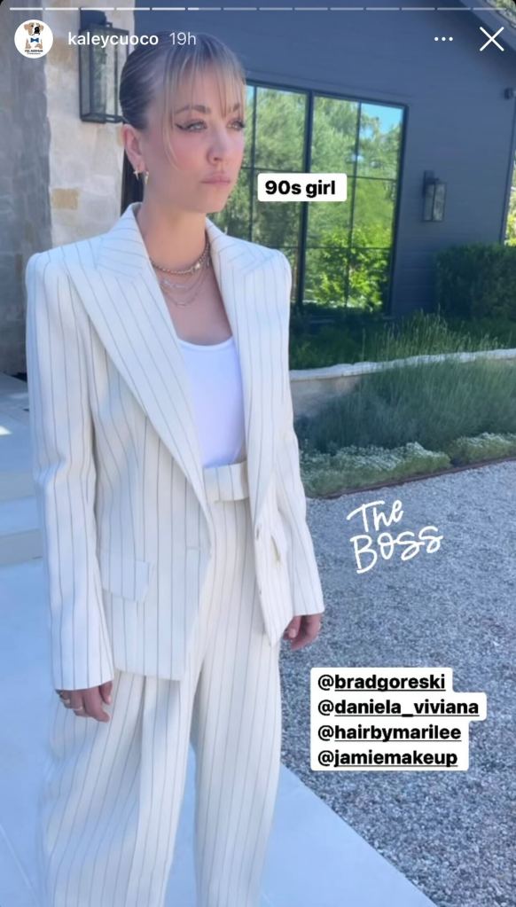 Kaley Cuoco posing in a white suit on her Instagram story.