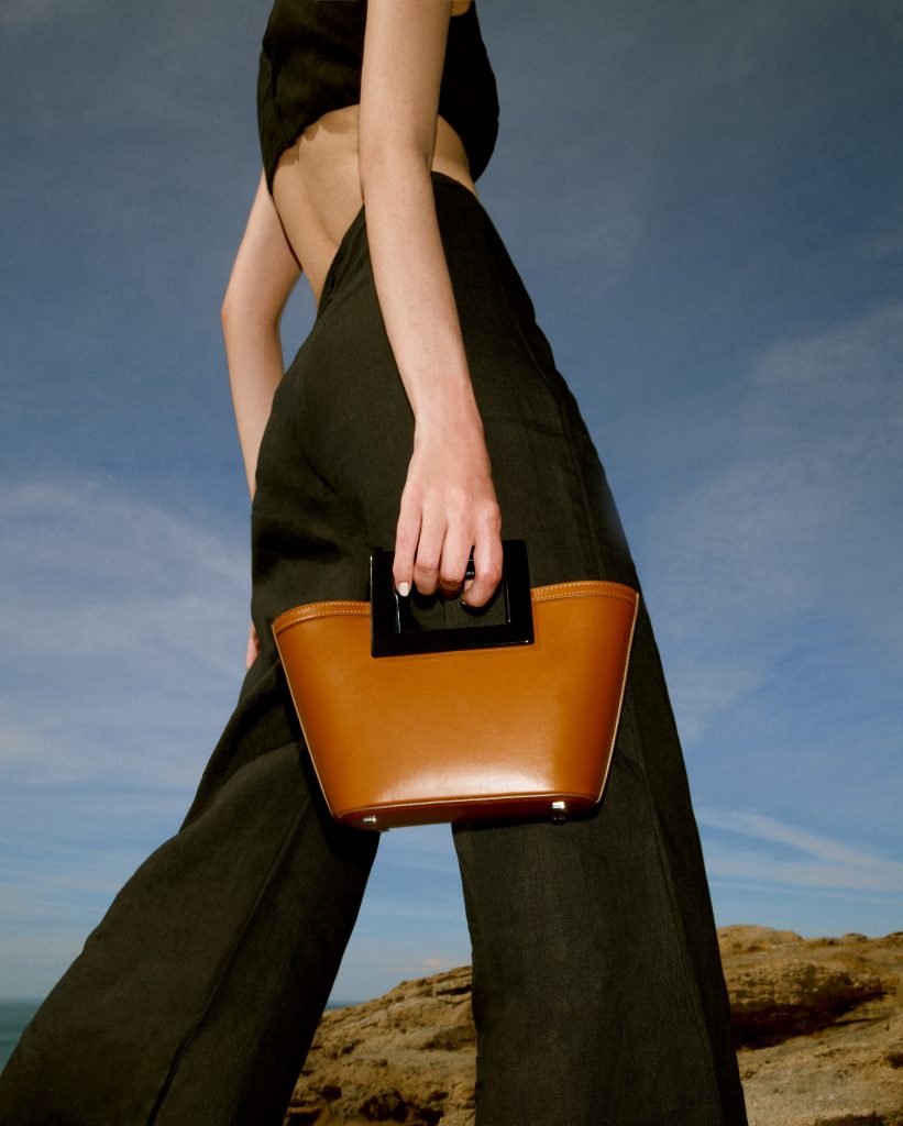 A photo of Marina Raphael's luxury bag, Micro Riviera, in the color Caramel Napa