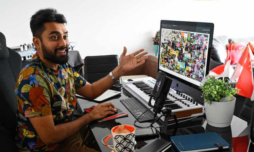 Blockchain entrepreneur Vignesh Sundaresan, also known as MetaKovan, showing the Beeple NFT he bought for $69m.