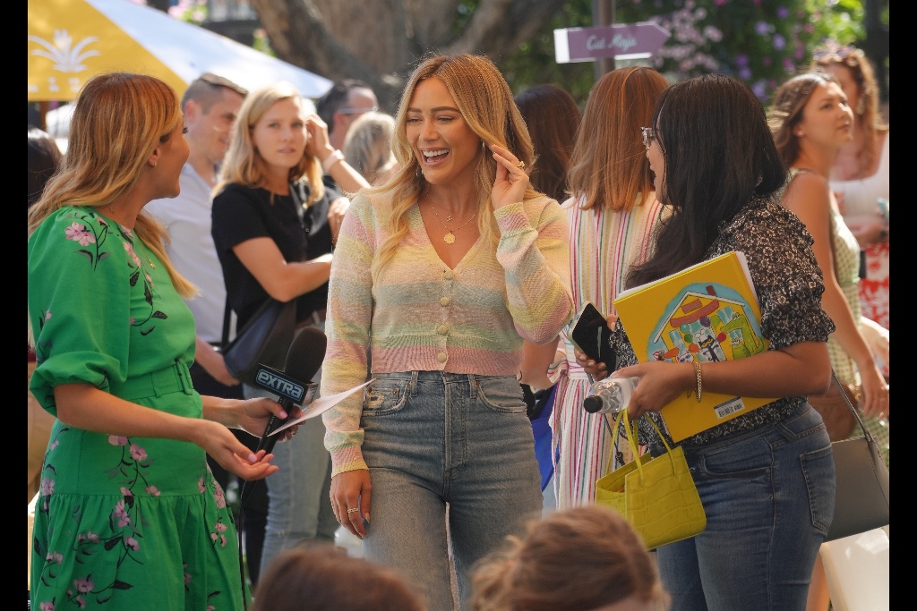 hilary duff, mom jeans, loveshackfancy colorful cardigan, sweater, stripes, white strappy heels, st jude research hospital