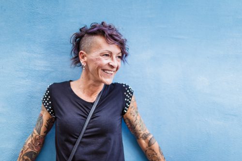Portrait of urban Italian tattooed woman on the street