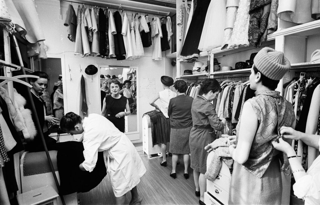 5th April 1965:  Ginette Spaniel, directrice of Pierre Balmain's Paris fashion house co-ordinates the backstage goings-on at a fashion show.  (Photo by Reg Lancaster/Express/Getty Images)