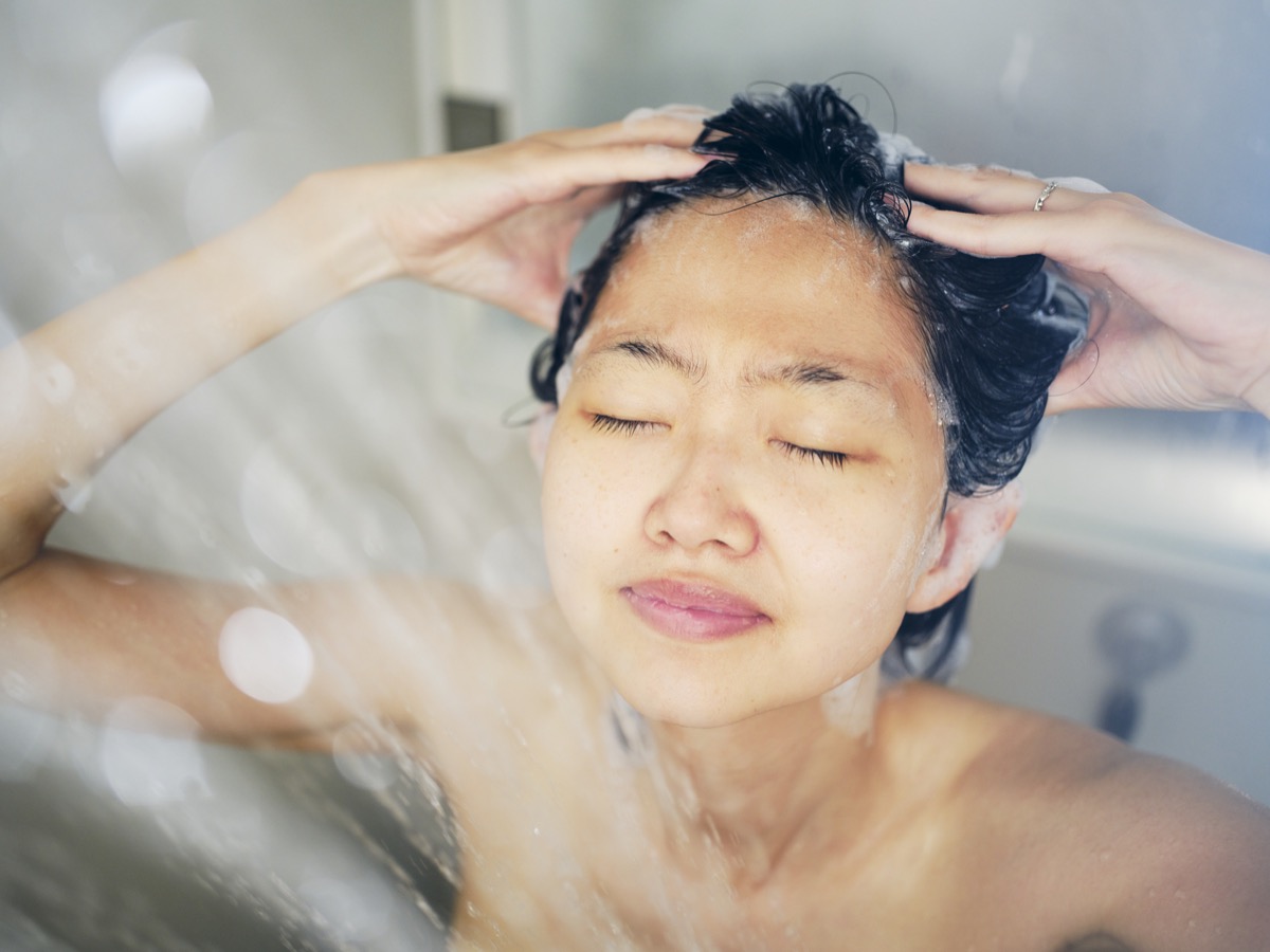 woman relaxing in a warm shower.