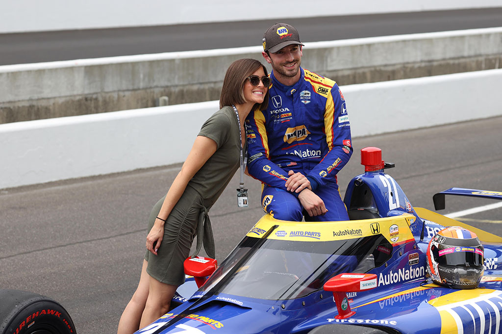 NTT Indy Car series driver Alexander Rossi poses for a photo with his girlfriend Kelly Mossop after qualifying for the 105th running of the Indianapolis 500 on May 22, 2021 at the Indianapolis Motor Speedway in Indianapolis, Indiana. 