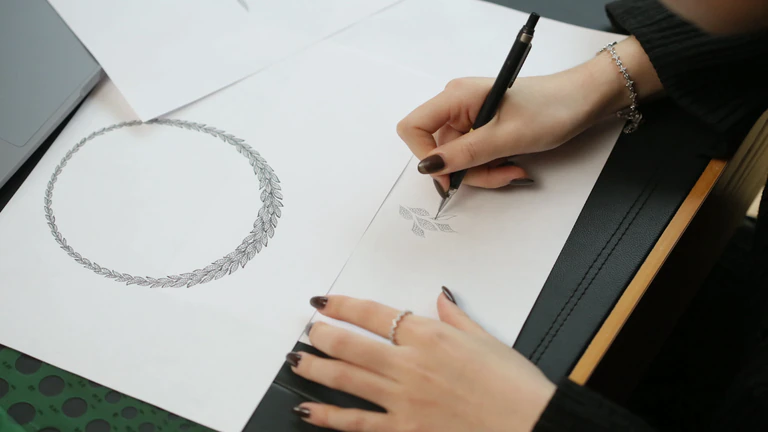 Designer working on an APM Monaco necklace design.