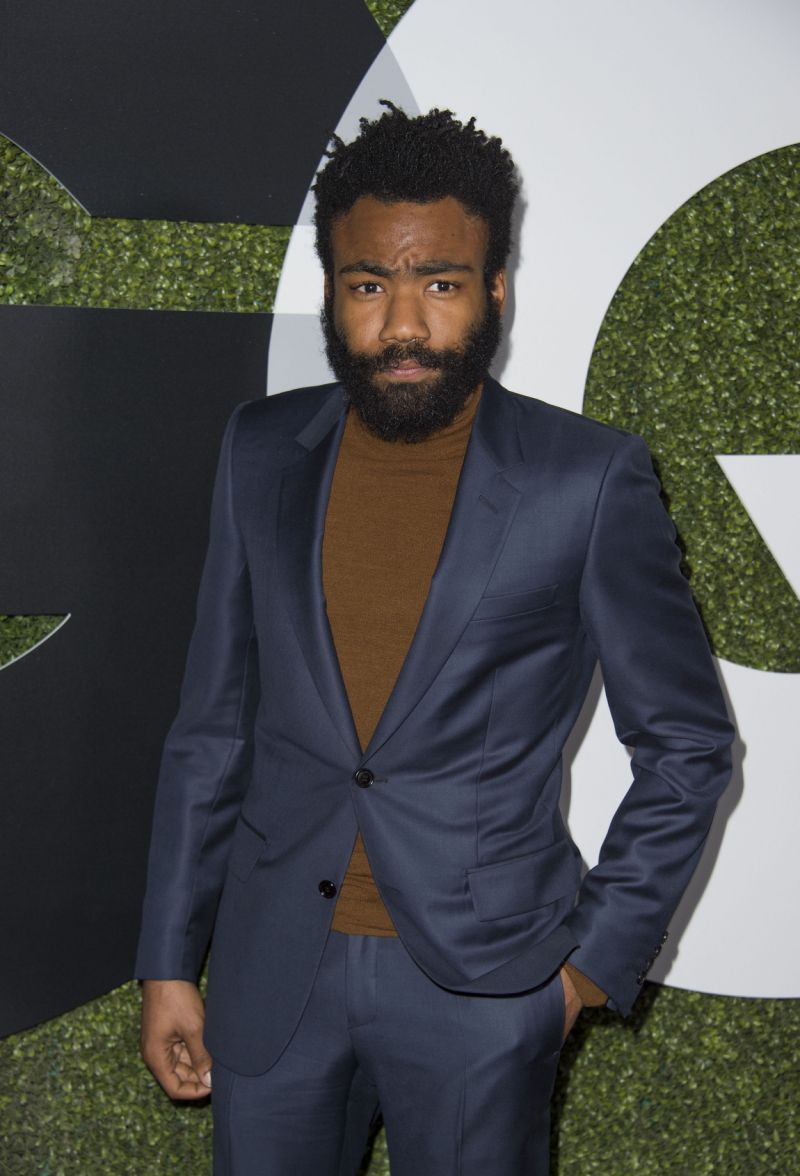 donald glover wearing a turtleneck with a suit