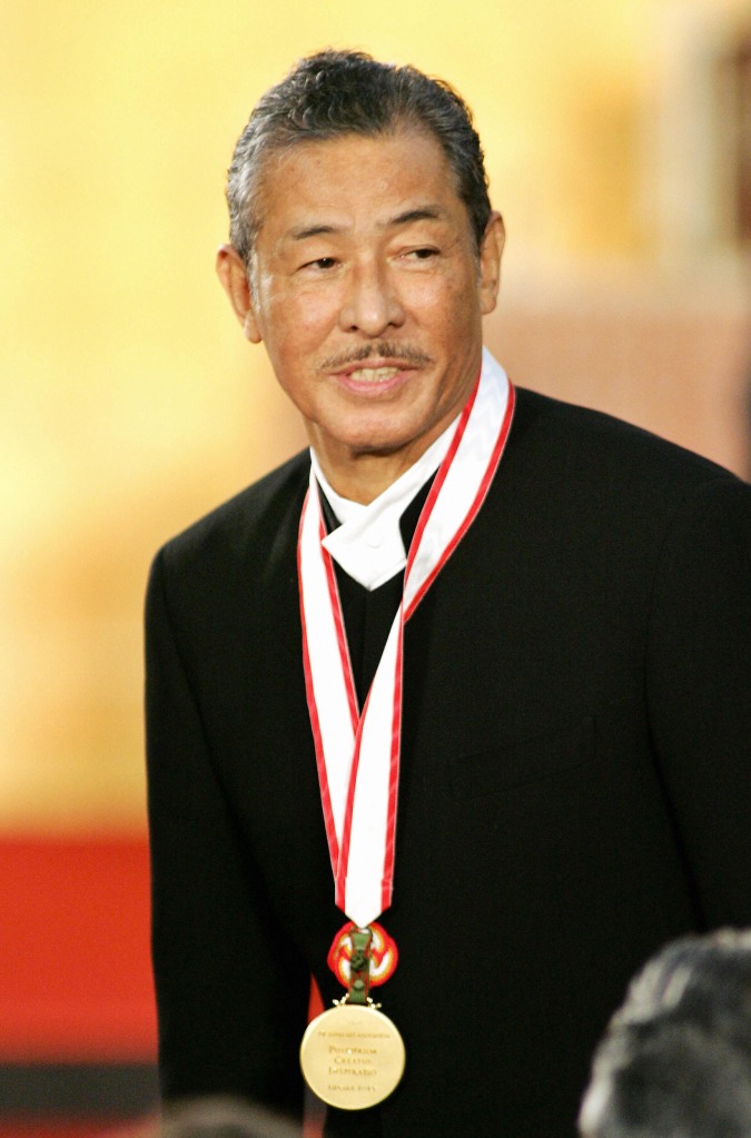 Japanese fashion designer Issey Miyake smiles after receiving the gold medal of the Praemium Imperiale at the awarding ceremony in Tokyo, October 18, 2005. 