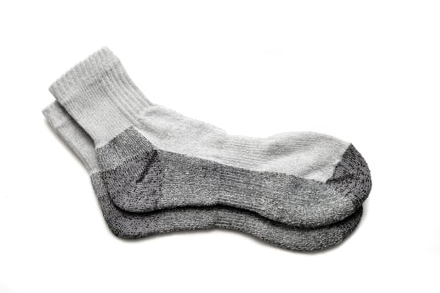 A pair of socks with additional enforcement and padding on the heel and toe.