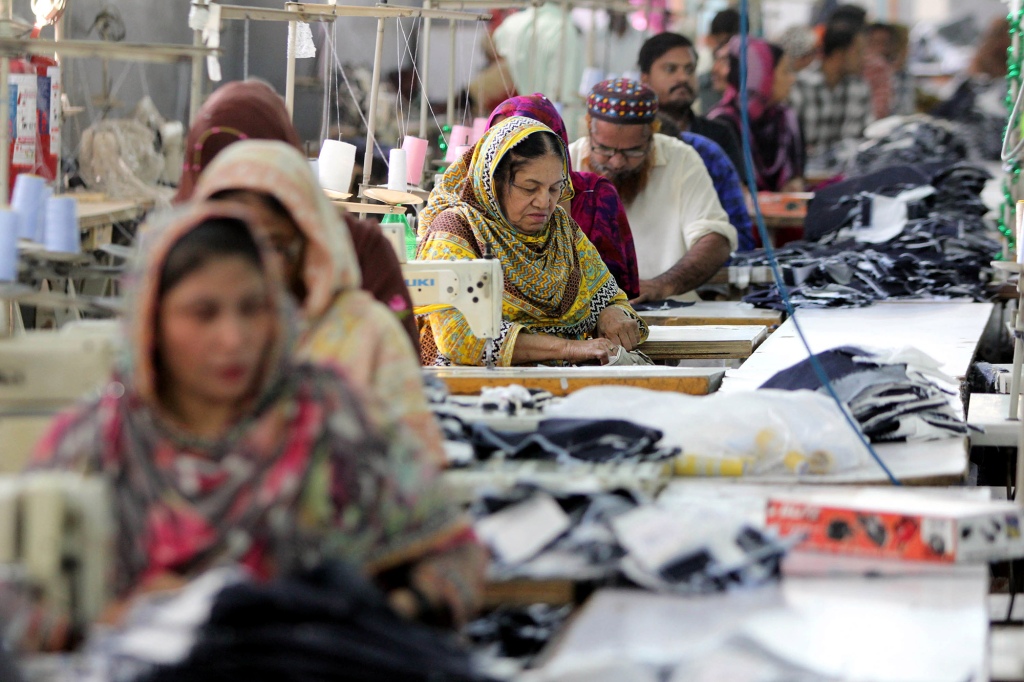 Laborers are seen working in a garment factory in southern Pakistan back in 2019. Fast fashion is cheap to make and sold at affordable price points. 
