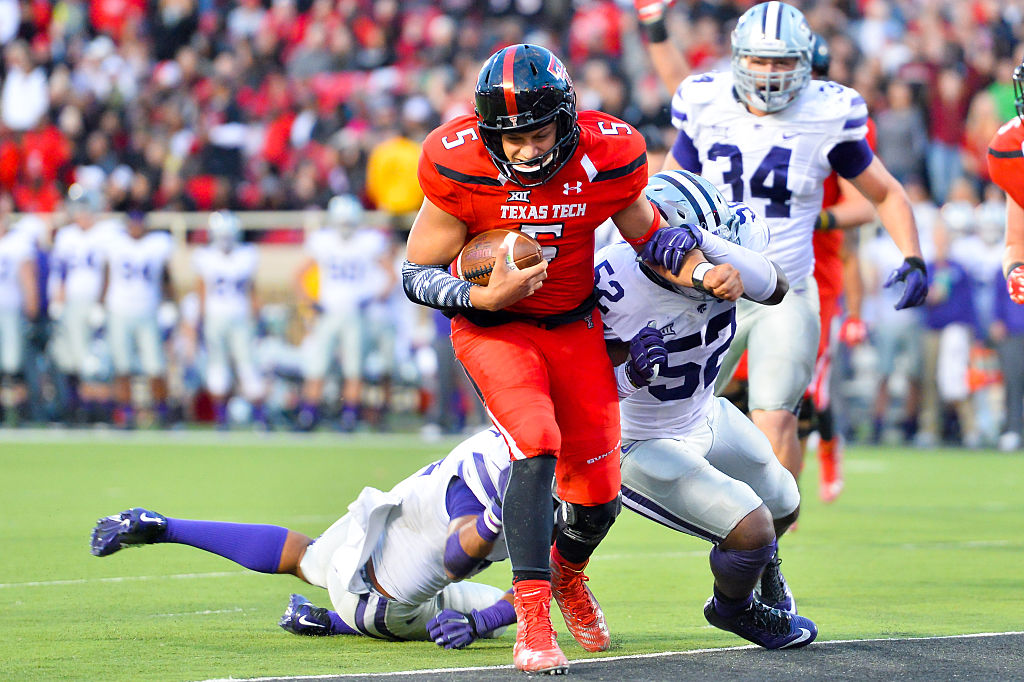 patrick mahomes in texas tech jersey, LUBBOCK, TX - NOVEMBER 14:Patrick Mahomes #5 of the Texas Tech Red Raiders breaks the tackle of Charmeachealle Moore #52 of the Kansas State Wildcats and scores during the game on November 14, 2015 at Jones AT&T Stadium in Lubbock, Texas. Texas Tech won the game 59-44. (Photo by John Weast/Getty Images)