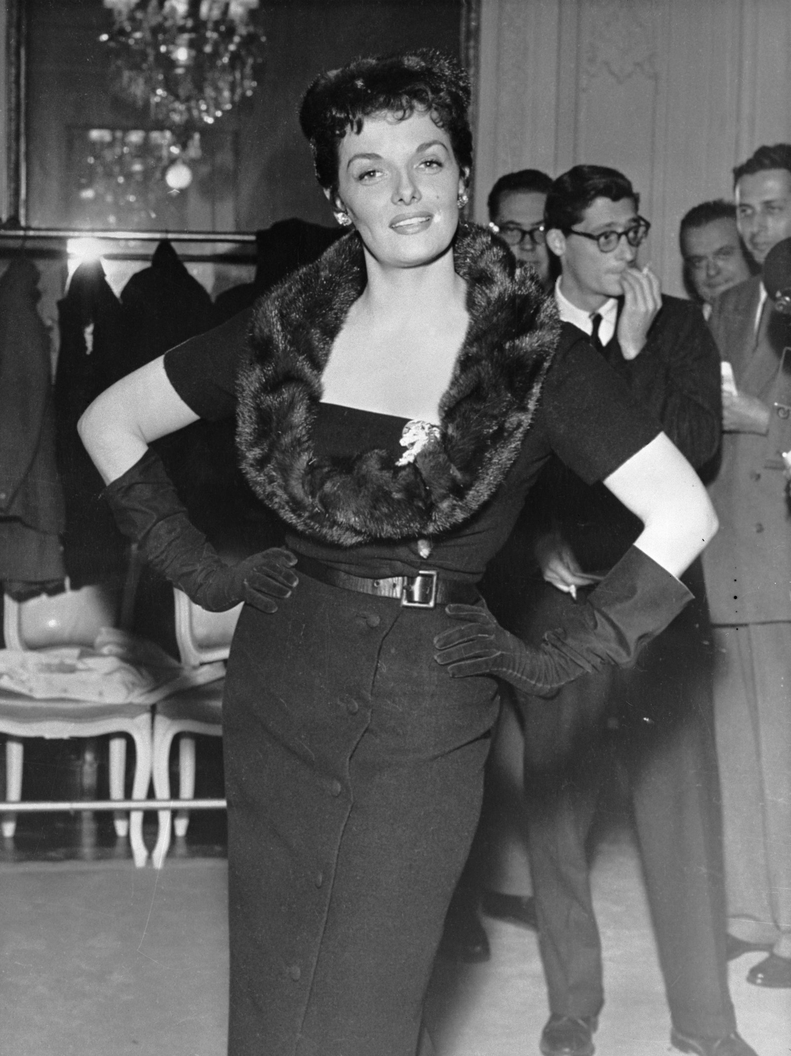 Actor Jane Russel seen modeling one of Christian Dior's new silhouettes in 1954.