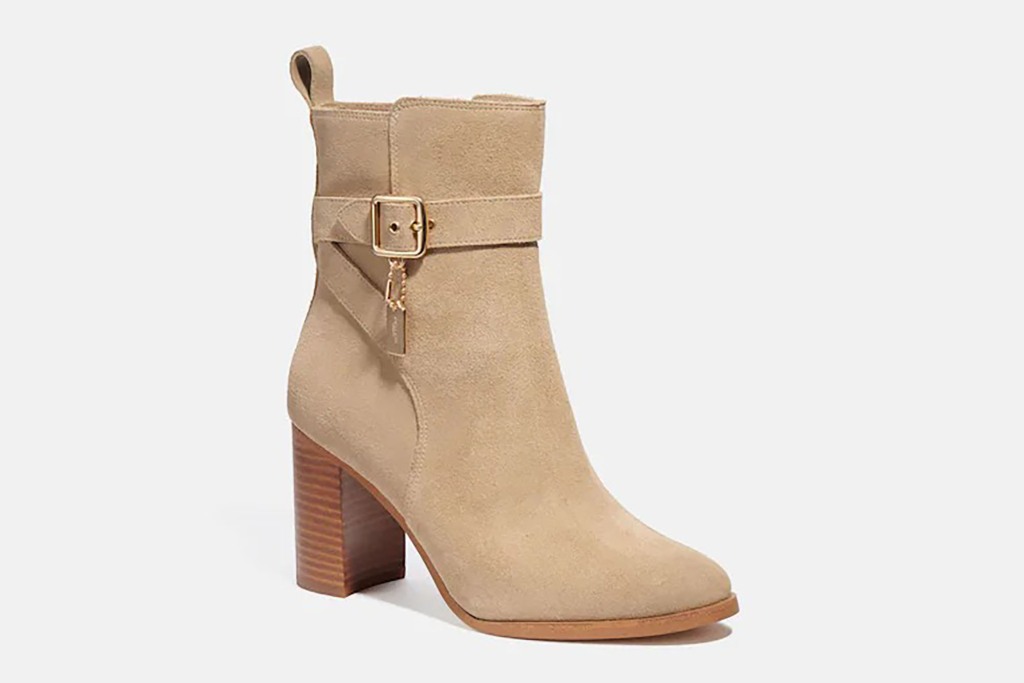 A tan bootie with a heel