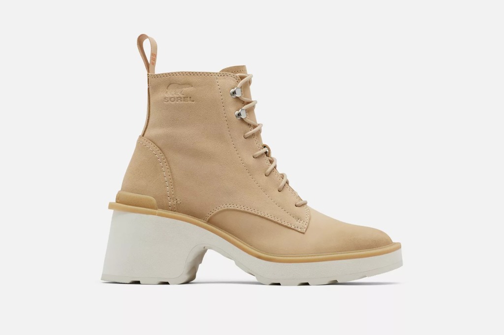 A tan boot with a white heel