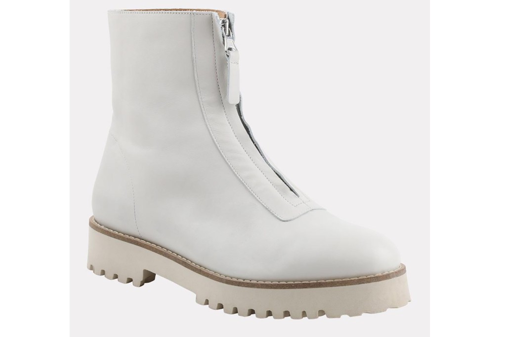 A white boot with a zipper in the middle of the front 