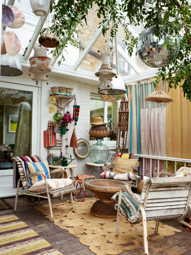 Glass ceiling: colourful rugs, hanging lanterns and comfortable chairs make the conservatory a wonderful place to relax.