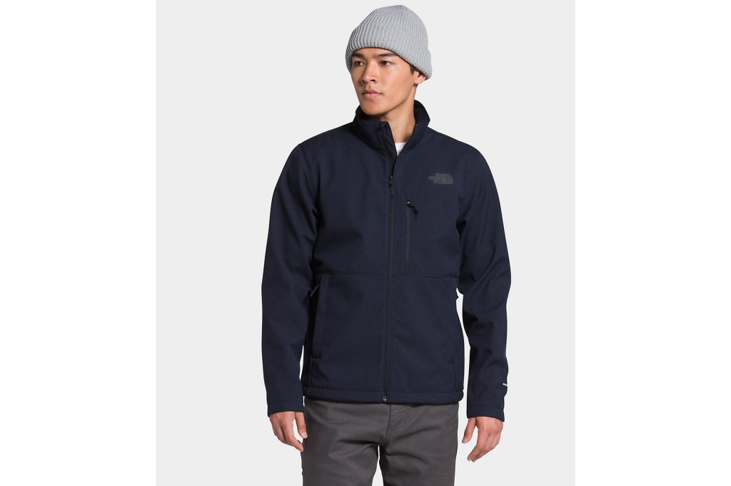 A man in a navy zip up hoodie 