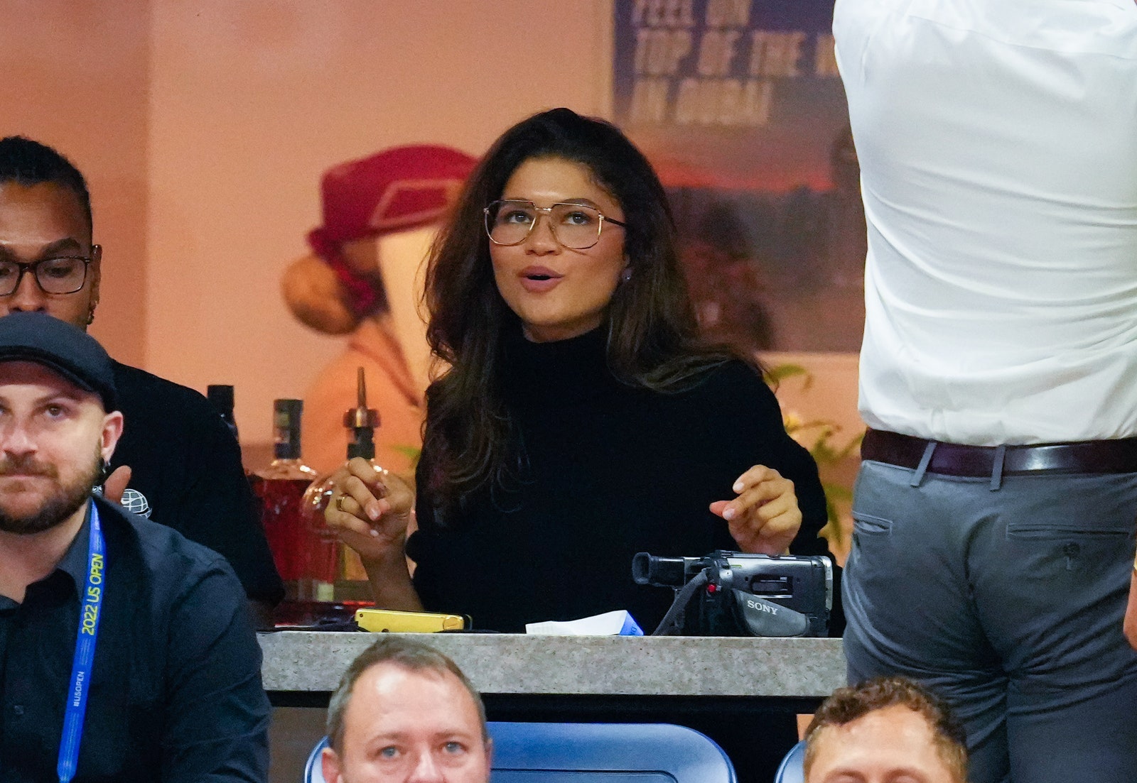 closeup of zendaya at 2022 us open with voluminous blowout and black turtleneck