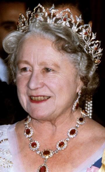 The Queen Mother wore Queen Victoria's Oriental Circlet tiara to a 1978 dinner at the Portuguese Embassy in London. It was designed by Prince Albert for his wife, Queen Victoria, in 1853. Allegedly, the prince was so inspired by a collection of Indian jewels gifted to Queen Victoria, that he felt compelled to design his own based on the floral motifs. After he gave the diadem to his wife, she commissioned a matching necklace, earrings and brooch.