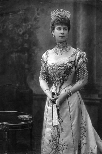 In 1901, the Duke and Duchess of Cornwall and York — King George V and Queen Mary's titles before they became monarchs — toured the British Empire for eight months. When they returned to London, King Edward VII offered the Duke the title of Prince of Wales, making the Duchess, Mary, Princess of Wales. To celebrate her new title, she commissioned a tiara for herself using the 675 diamonds that De Beers had presented her as a gift. Here, Mary, who became queen in 1911, wore the tiara for a royal portrait.