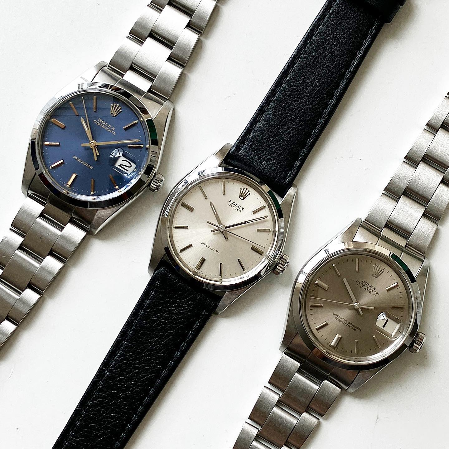 Three Rolex watches with different straps