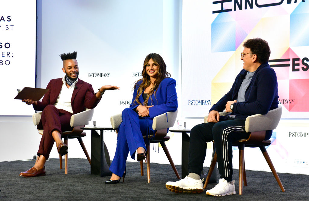 NEW YORK, NEW YORK - SEPTEMBER 22: (L-R) KC Ifeanyi, Priyanka Chopra Jonas, Actor, Producer, Philanthropist, and Anthony Russo, Director, Producer; Cofounder, AGBO, speak onstage during The Fast Company Innovation Festival - Day 3 on September 22, 2022 in New York City. (Photo by Eugene Gologursky/Getty Images for Fast Company)