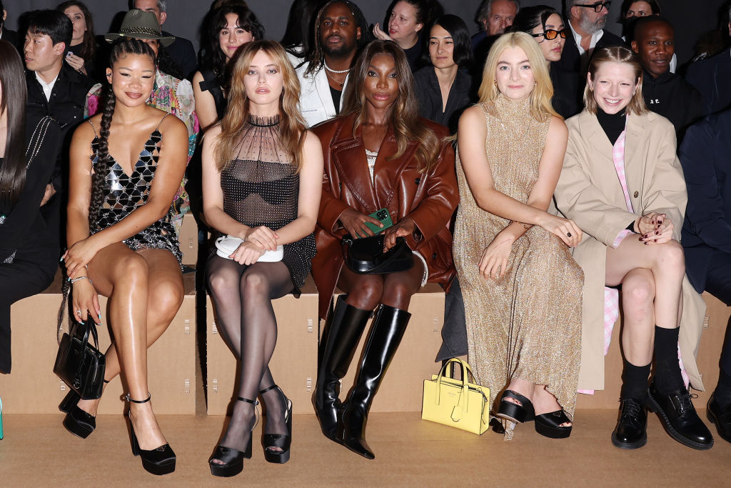 MILAN, ITALY - SEPTEMBER 22: (L-R) Storm Reid, Katherine Langford, Michaela Coel, Lorde and Hunter Schafer attend the Prada show during Milan Fashion Spring/Summer 2023 on September 22, 2022 in Milan, Italy. (Photo by Jacopo M. Raule/Getty Images for Prada)