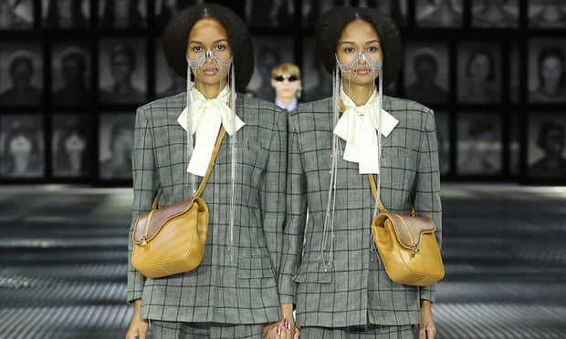 Models walk the runway of the Gucci Twinsburg show in Milan, Italy.