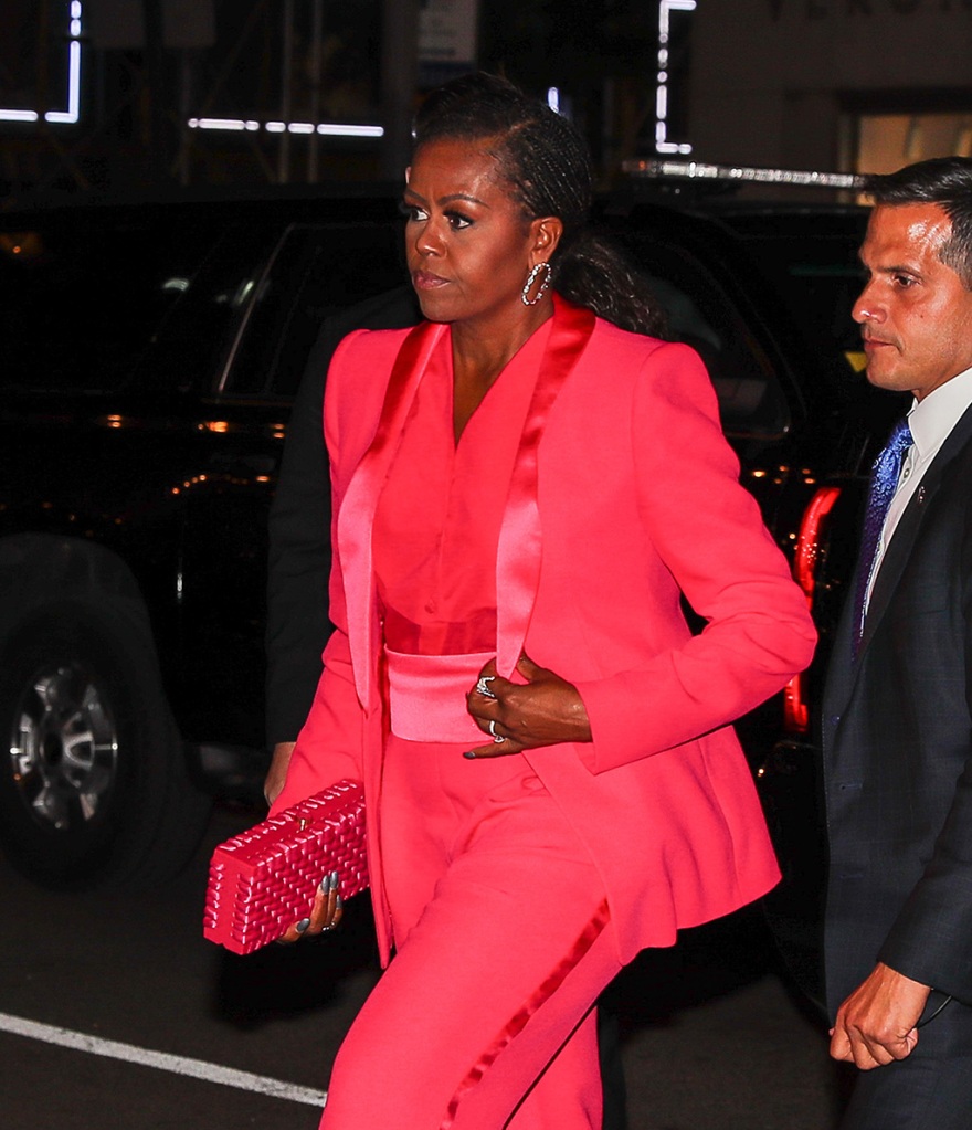 Michelle Obama wore a bright pink suit while arriving back at The Mark Hotel for the Albie Awards afterparty on Sept. 30, 2022 in New York.