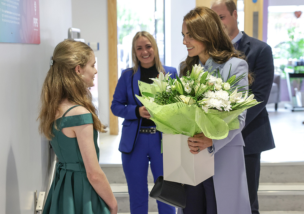 Catherine, Princess of Wales speaks with staff during her visit to the PIPS (Public Initiative for Prevention of Suicide and Self Harm) charity with Prince William, Prince of Wales on October 06, 2022 in Belfast, Northern Ireland.