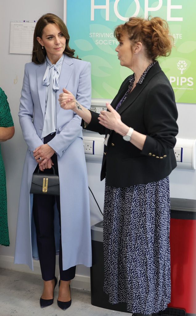 Catherine, Princess of Wales speaks with staff during her visit to the PIPS (Public Initiative for Prevention of Suicide and Self Harm) charity with Prince William, Prince of Wales on October 06, 2022 in Belfast, Northern Ireland.