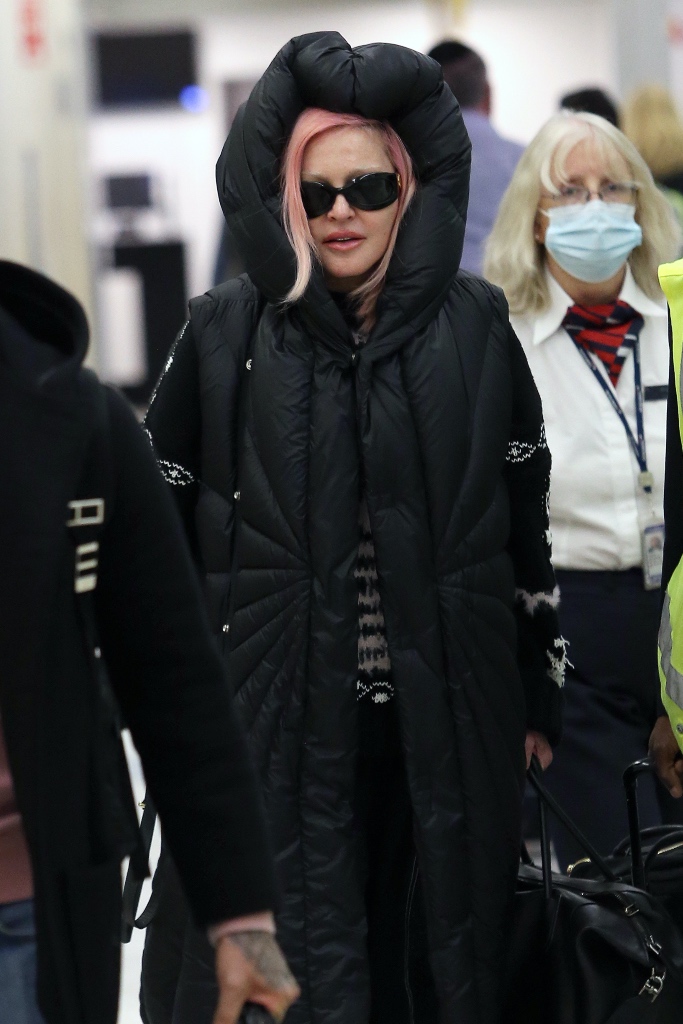madonna, jfk airport, black coat, balenciaga crocs, platform, hood, sunglasses