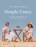 Cover of Simple Fancy cookbook featuring two women eating a meal at the beach