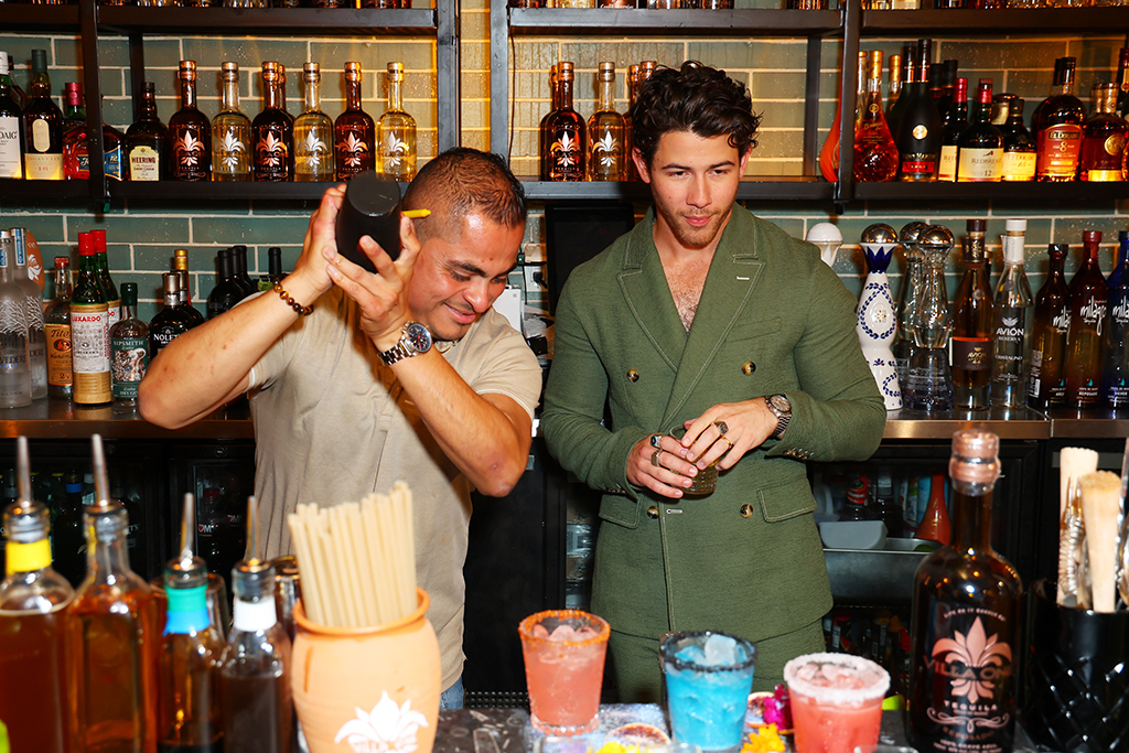 Carlos Ramirez and Nick Jonas celebrates the grand opening of his new San Diego Rooftop restaurant with John Varvatos, Villa One Tequila Gardens on October 07, 2022 in San Diego, California.