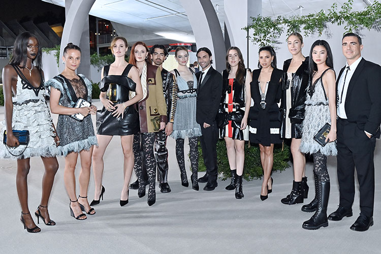 (L-R) Lous and the Yakuza, Alicia Vikander, Renate Reinsve, Sophie Turner, Joe Jonas, Emma Stone, Nicolas Ghesquière, Alana Haim, Jurnee Smollett, Este Haim, Jung Ho-yeon and Drew Kuhse 
Louis Vuitton @ The Academy Museum Gala