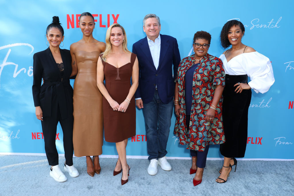 LOS ANGELES, CALIFORNIA - OCTOBER 17: (L-R) Bela Bajaria, Zoe Saldaña, Reese Witherspoon, Nexflix CEO Ted Sarandos, Attica Locke, and Tembi Locke attend Netflix's "From Scratch" Special Screening at Netflix Tudum Theater on October 17, 2022 in Los Angeles, California. (Photo by Leon Bennett/Getty Images for Netflix)